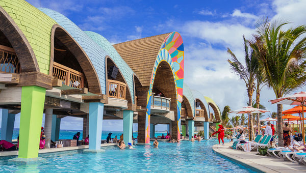 The Party Cove, which has a DJ and swim-up bar, sits between the two beaches. The Party Cove, which has a DJ and swim-up bar, sits between the two beaches.