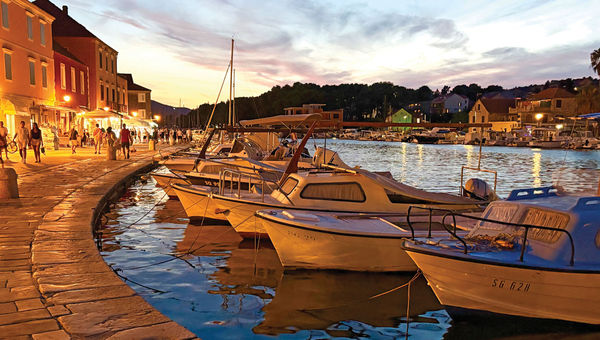 Sailboats docked in the harbor at dusk in Stari Grad, on Hvar.