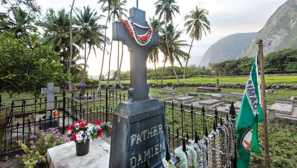 Father Damien's grave lies next to St. Philomena Church. Father Damien's grave lies next to St. Philomena Church.