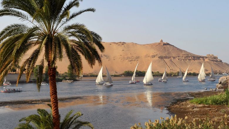 Boats sailing the Nile in Aswan, Egypt.