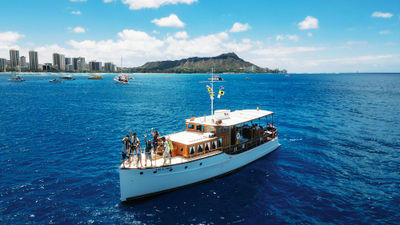 The Vida Mia cruises the coast of Waikiki on a morning coffee cruise.