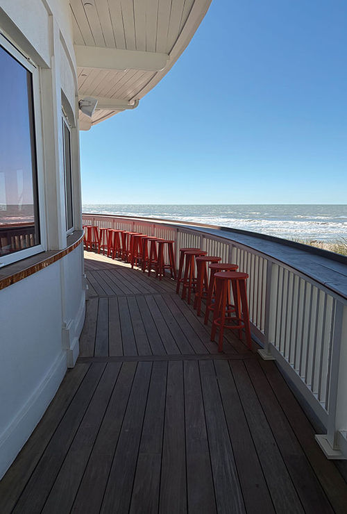 The Sunset Bar provides a prime view for hotel guests and locals alike of the sun sinking into the ocean each evening. The Sunset Bar provides a prime view for hotel guests and locals alike of the sun sinking into the ocean each evening.