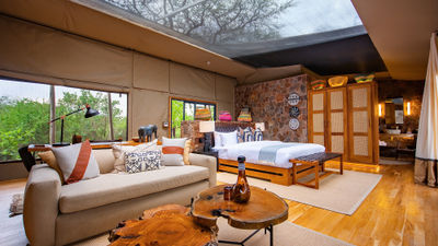 A deluxe tent at the Mapito Safari Camp in Tanzania. Tented suites include retractable roofs and are equipped with telescopes for stargazing.