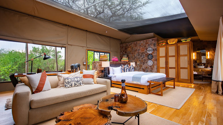 A deluxe tent at the Mapito Safari Camp in Tanzania. Tented suites include retractable roofs and are equipped with telescopes for stargazing.