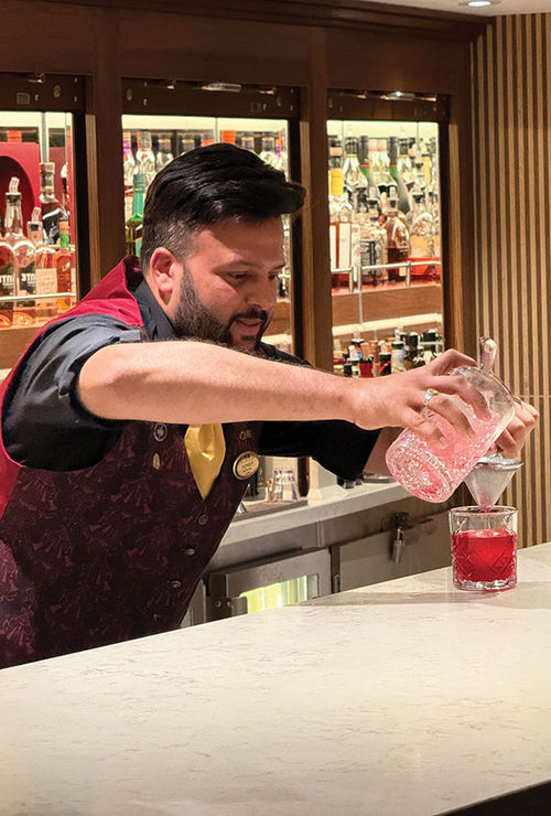 A bartender pours one of the five new Princess Cruises cocktails created in partnership with Handshake Speakeasy. A bartender pours one of the five new Princess Cruises cocktails created in partnership with Handshake Speakeasy.