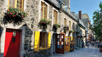 A narrow cobblestone street with colorful signs and shops, Rue du Petit-Champlain is the oldest commercial street in North America.