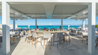 The menu at Pelago centers on Mediterranean cuisine infused with Asian flavor profiles, highlighted by dishes like the hot smoked Peking duck breast.
