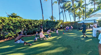 Kids join a game of tug-of-war on the back lawn at the W South Beach.