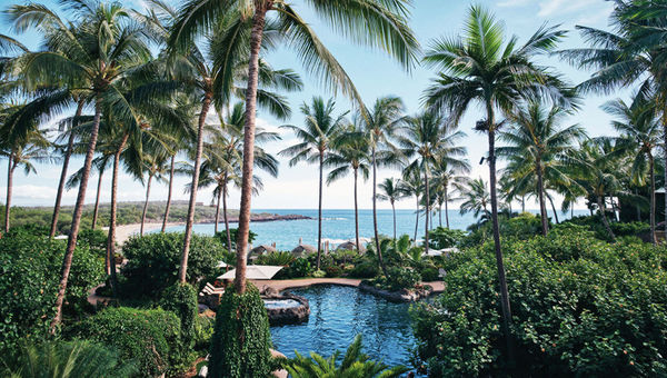 A guest lounges in a spot overlooking the beach at Four Seasons Resort Lanai. A guest lounges in a spot overlooking the beach at Four Seasons Resort Lanai.