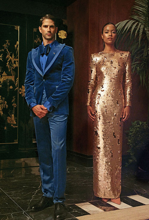Team member uniforms at the Waldorf Astoria New York's Peacock Alley cocktail bar include blue suits with velvet blazers and floor-length sequin gowns.