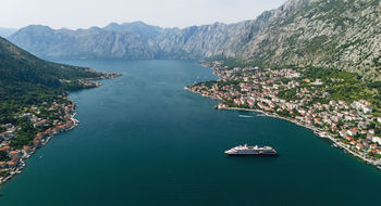 Atlas Ocean Voyages’ World Traveller in Montenegro. Prices for Europe cruises are up this summer.