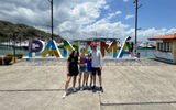 The author's family in front of a "Panama" sign along Panama City's waterfront.