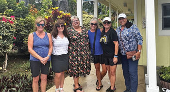 Travel advisor Kristi Emo, third from left, with one of her fam groups at the Punalu'u Bake Shop in Na'alehu on the Big Island of Hawaii.