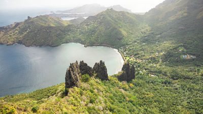 The volcanic pitons towering over the village of Hatiheu on the island of Nuku Hiva.