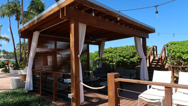 A Tiki Pool & Beach cabana, which is located between the pool deck and the beach.