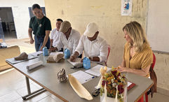 Community leaders sign a memorandum of commitment at a school in Colombia.