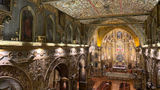 The interior of La Iglesia y Monasterio de San Francisco, one of several ornate churches in Quito.