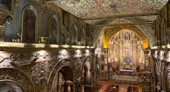 The interior of La Iglesia y Monasterio de San Francisco, one of several ornate churches in Quito.