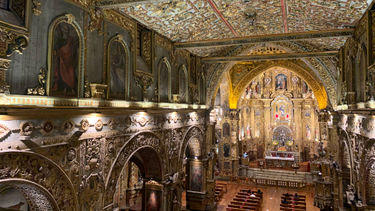 The interior of La Iglesia y Monasterio de San Francisco, one of several ornate churches in Quito.