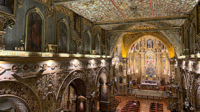 The interior of La Iglesia y Monasterio de San Francisco, one of several ornate churches in Quito.