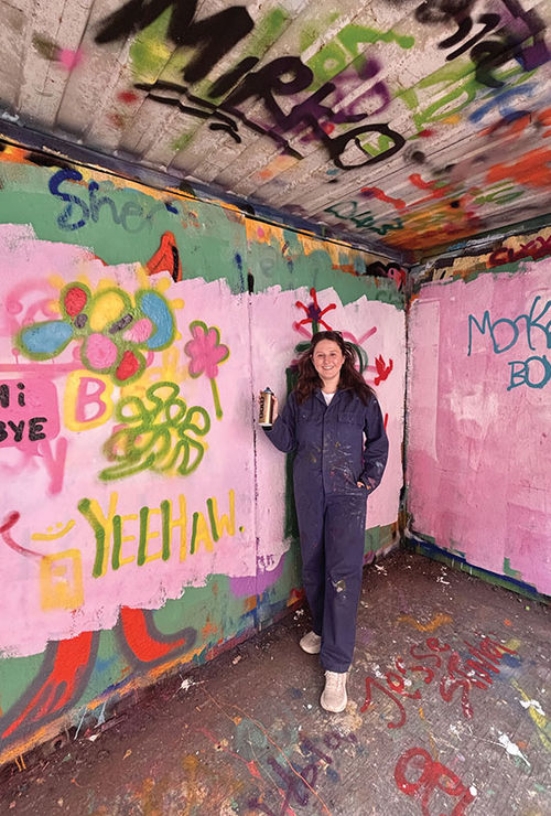 The author tries her hand at graffiti art during an excursion at the STRAAT Museum in Amsterdam. The author tries her hand at graffiti art during an excursion at the STRAAT Museum in Amsterdam.