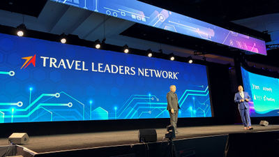 Stephen McGillivray (left) and Cory Voss on stage at Travel Leaders Network's Edge conference.