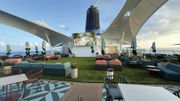 The new Sunset Park on Deck 15 includes an artificial turf lawn, cabanas, plenty of seating, a movie screen and the Sunset Park Cafe.