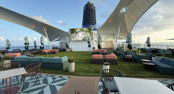 The new Sunset Park on Deck 15 includes an artificial turf lawn, cabanas, plenty of seating, a movie screen and the Sunset Park Cafe.