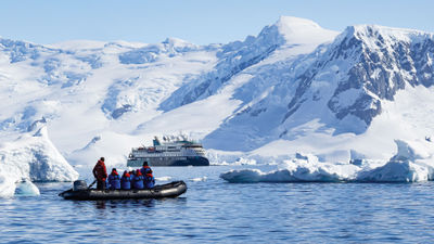 Aurora Expeditions guests in a Zodiac in Antarctica.