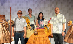 The late Nalani Kanakaole's husband Sig Zane (front left) and son Kuhao Zane (front right), with cocurators Kaui Kanakaole and Sarah Kuaiwa in front of one of the displays.
