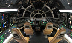 The cockpit of the Millennium Falcon, where guests control the action during Millennium Falcon: Smugglers Run.