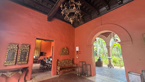The hotel's open-air reception area is decorated in deep colors and antiques from the colonial era and the convent that it originally housed. The hotel's open-air reception area is decorated in deep colors and antiques from the colonial era and the convent that it originally housed.