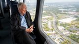 Viking chairman Tor Hagen looking out the window of a zeppelin over Cologne, Germany.