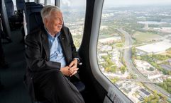 Viking chairman Tor Hagen looking out the window of a zeppelin over Cologne, Germany.