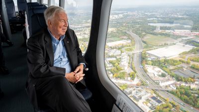 Viking chairman Tor Hagen looking out the window of a zeppelin over Cologne, Germany.