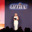 Ragan Stone, senior vice president of In the Know Experiences, on stage during Global Travel Collection's Arrive 2026.