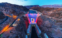 Hoover Dam is illuminated in patriotic colors at dusk each night through July 4, part of southern Nevada’s celebration of America250.