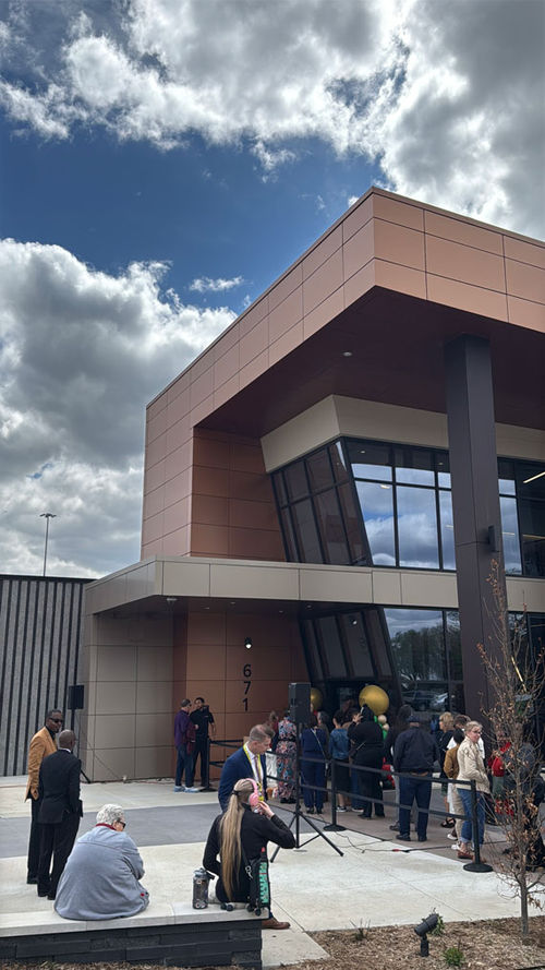 A line of people stand outside at the grand opening of the Center for Black Excellence and Culture. A line of people stand outside at the grand opening of the Center for Black Excellence and Culture.