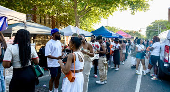 Crowds line the street as attendees browse vendor tents at the Juneteenth Food Festival at Weeksville in New York City.