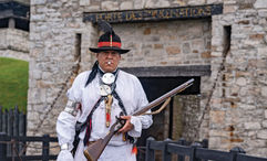 Jordan Smith, a member of the Mohawk Nation, stands in front of Old Fort Niagara, where he is head of Native American education.