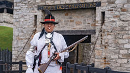 Jordan Smith, a member of the Mohawk Nation, stands in front of Old Fort Niagara, where he is head of Native American education.