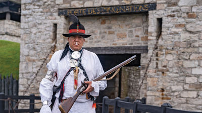 Jordan Smith, a member of the Mohawk Nation, stands in front of Old Fort Niagara, where he is head of Native American education.
