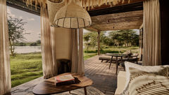 Each suite at Kitirua Plains Lodge includes a shaded private veranda overlooking a 128-acre private concession bordering Amboseli National Park.