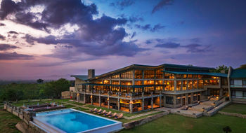 The main lodge at Wellworth Mikumi Wildlife Lodge. The new camp sits on a hillside in the Kikoboga area of Mikumi National Park and features 48 rooms built around a natural watering hole where elephants arrive uninvited at sundown.