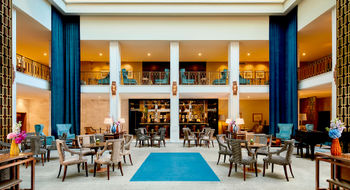 The hotel's recent interior restoration reveals the brilliance of renowned Portuguese architect Porfirio Monteiro's visionary design with its dramatic sunlit two-story atrium.
