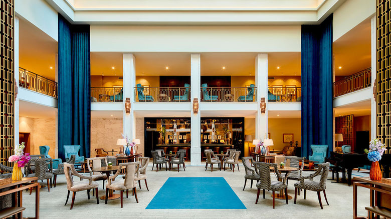 The hotel's recent interior restoration reveals the brilliance of renowned Portuguese architect Porfirio Monteiro's visionary design with its dramatic sunlit two-story atrium.