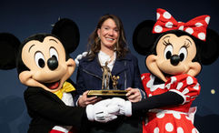 Caroline Beteta with Mickey and Minnie at her retirement dinner at Disneyland's Grand Californian Resort.