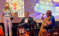 Chief dog officer Skipper and Royal Caribbean International CEO Michael Bayley embrace on the Legend of the Seas.