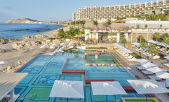 The two-level infinity pool at the Grand Velas Boutique Los Cabos overlooks the Sea of Cortes and boasts beautiful mosaic tiles of turquoise and green.