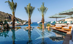 The main pool at Crete’s Daios Cove has the scenic Vathi Bay as its backdrop.